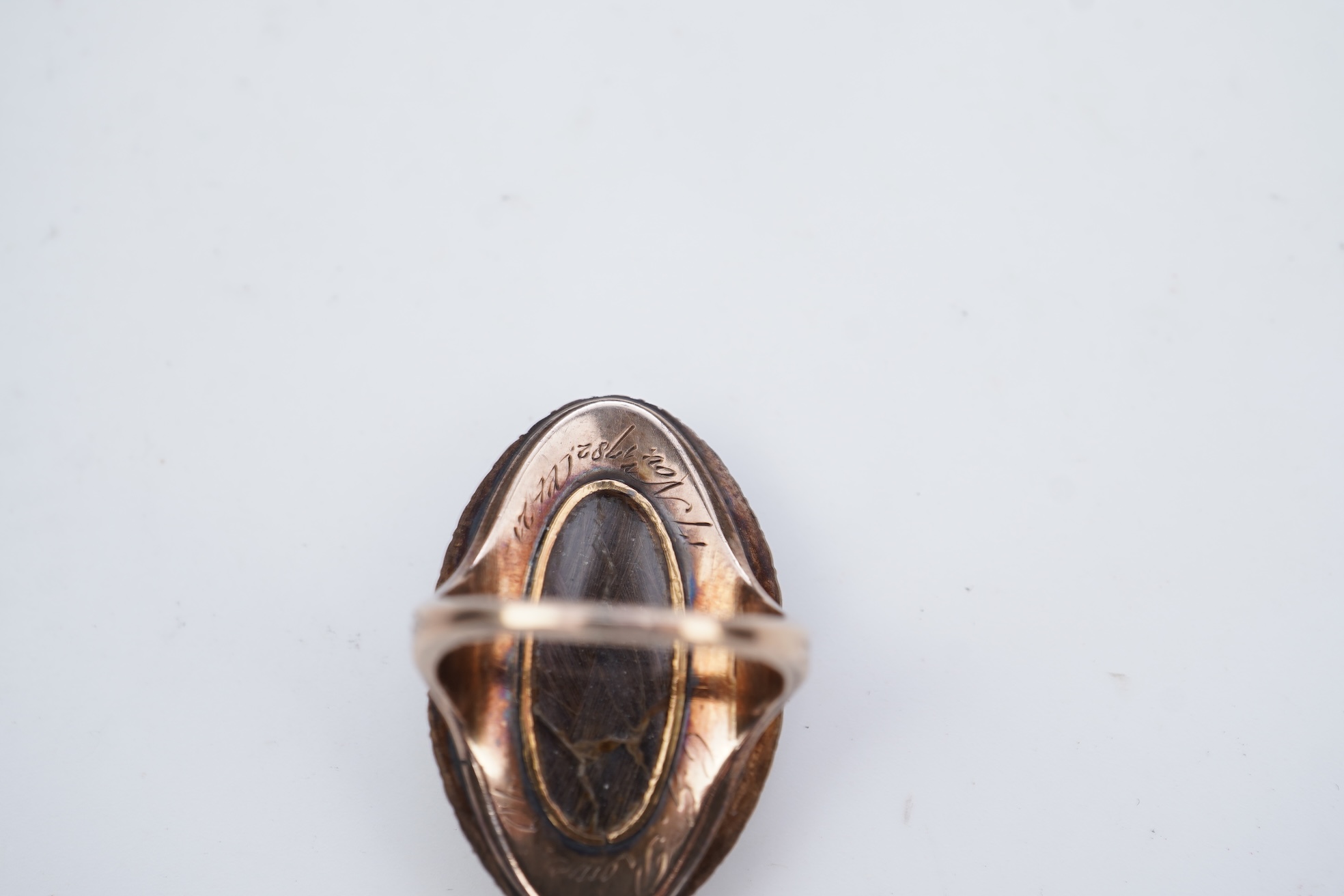 A fine George III seed pearl, enamel and diamond mourning ring, circa 1782